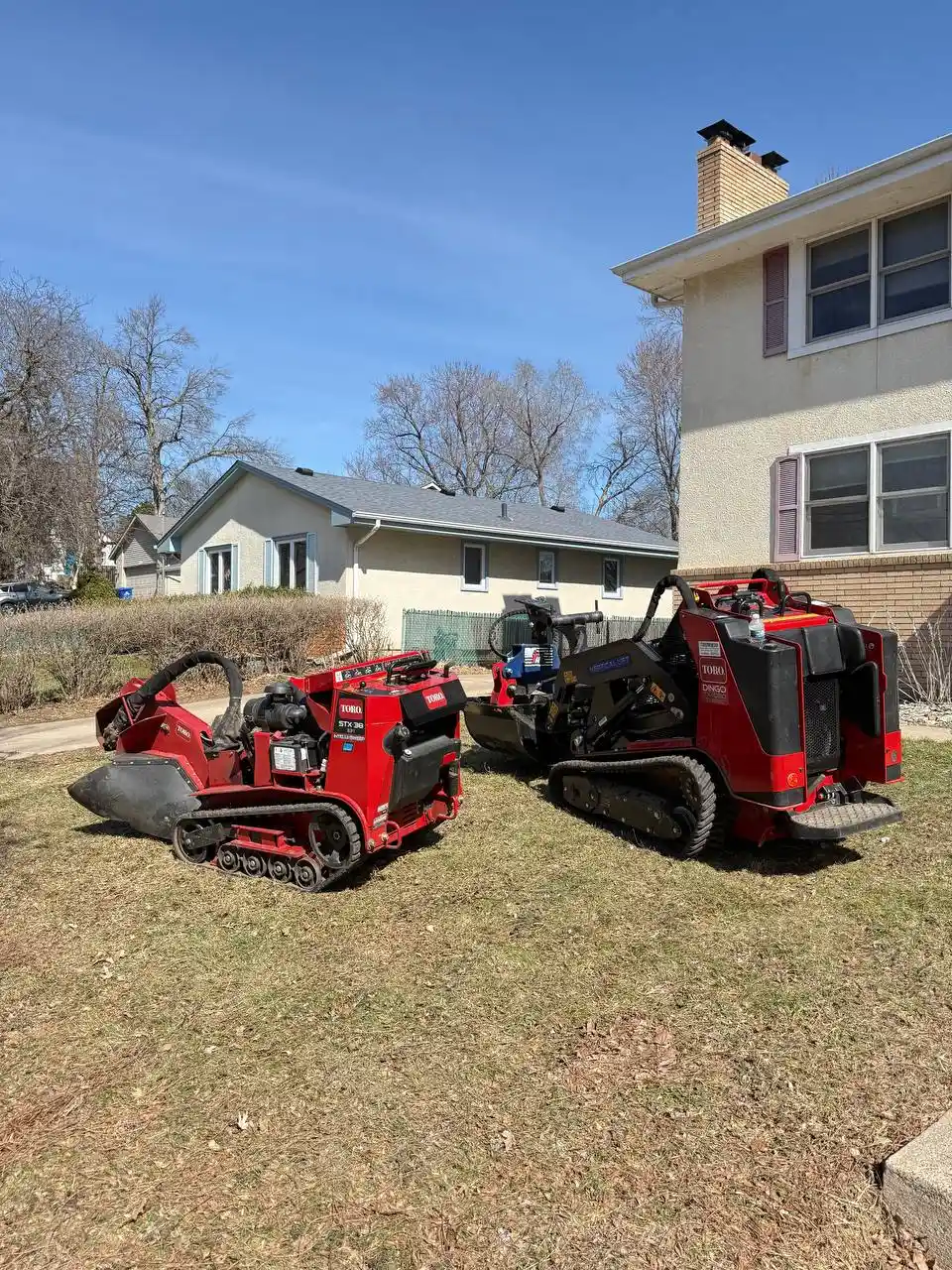 Professional KVN Pro Tree Service equipment on client lawn in MN