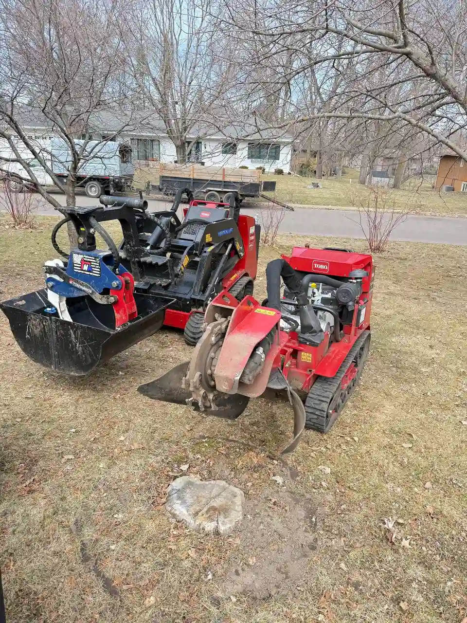 Toro Dingo and stump grinder equipment on residential lawn in Minnesota